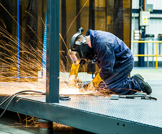 Welder working in a safe environment
