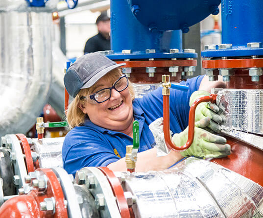 Lady working on a pipework module