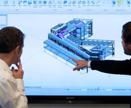 Workers reviewing BIM model