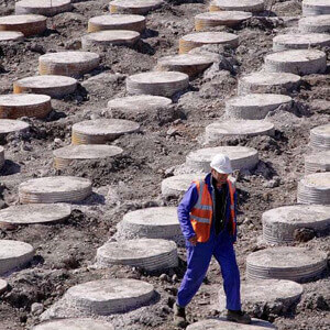 Employee in an area where vibro concrete columns have been installed