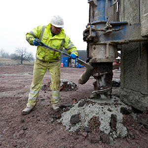 Employee carrying out ground improvement works