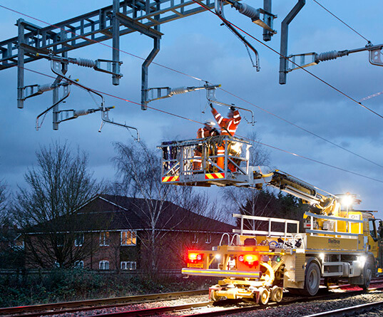 A rail mounted crane lifting out a life expired bridge deck