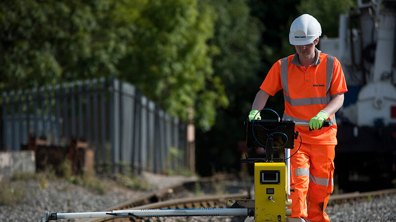 Person using lasersweep software on track