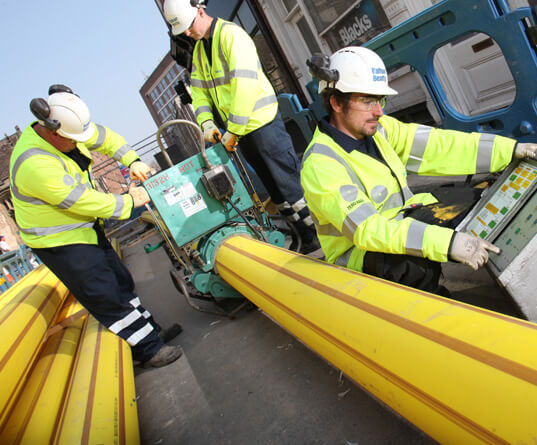 workers testing utility services